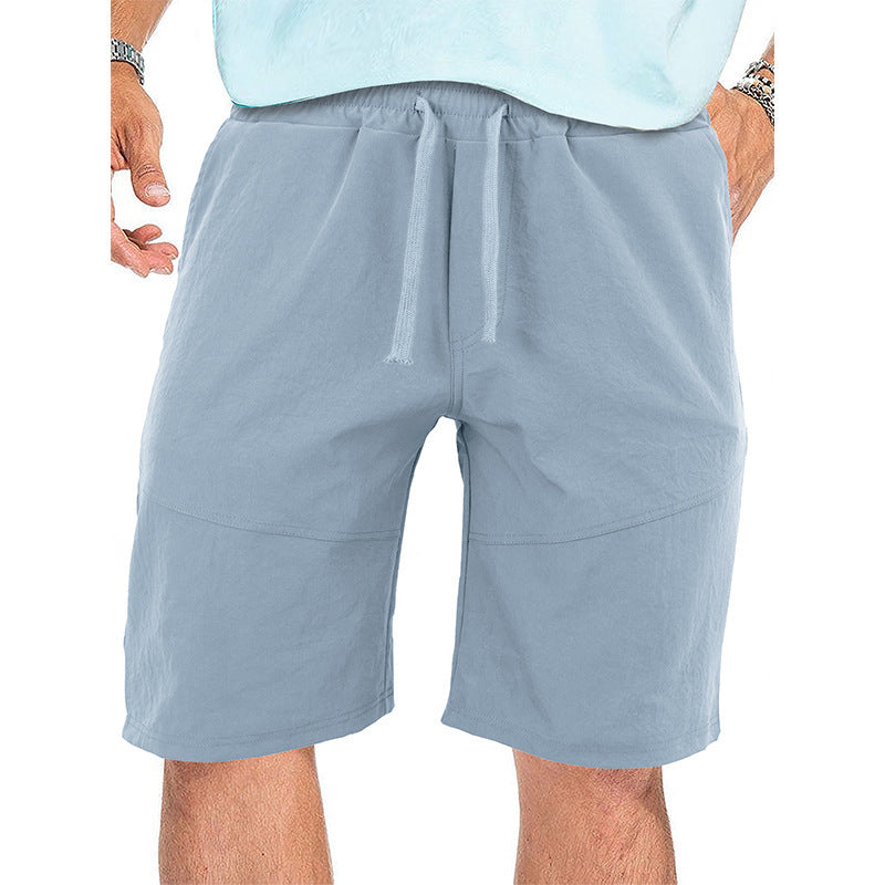 Men's casual light blue drawstring shorts with front pockets and elastic waistband