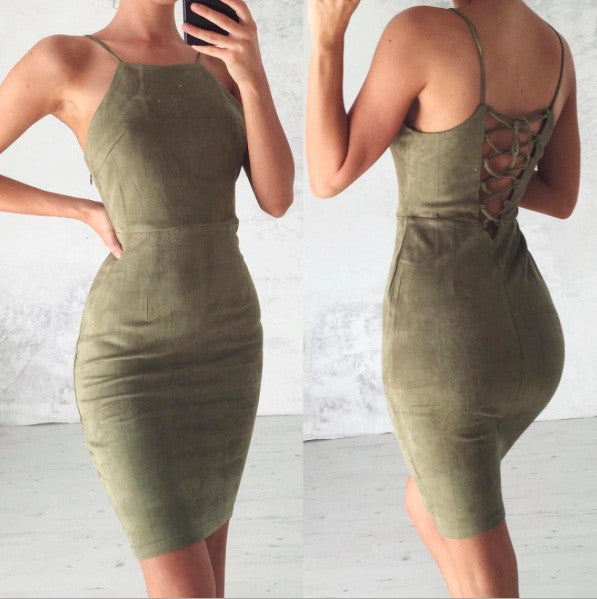 Woman wearing an olive green suede bodycon dress with spaghetti straps and lace-up back detail