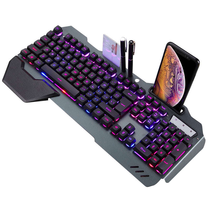RGB backlit gaming keyboard with phone holder, pen slots, and wrist rest on gray base