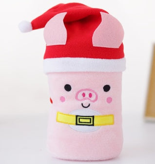Cute plush pig toy wearing a red Santa hat and yellow belt, festive holiday decoration