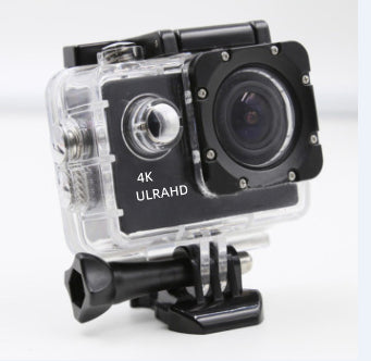 Compact 4K Ultra HD action camera in clear waterproof housing mounted on black base