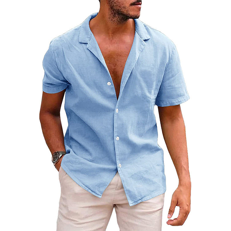 Man wearing light blue short-sleeve button-up shirt and beige pants, casual summer outfit