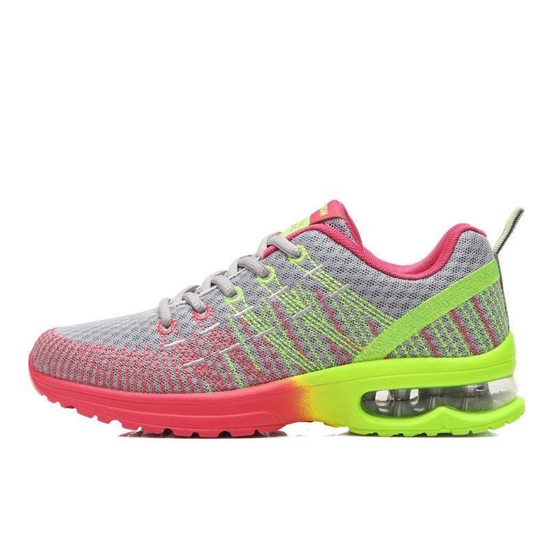 Gray mesh athletic shoe with red toe, neon green sole, and air cushion heel for running