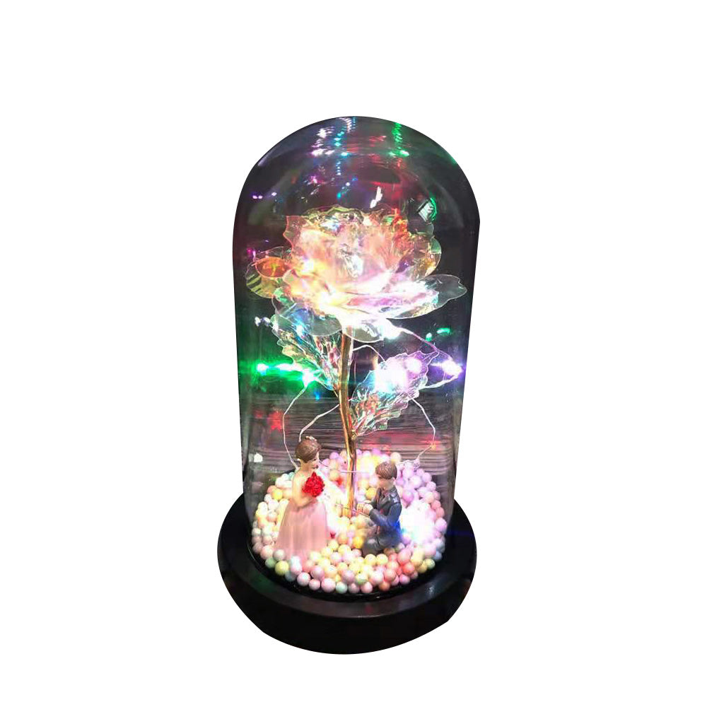 LED light rose in glass dome with miniature couple and colorful decorative beads
