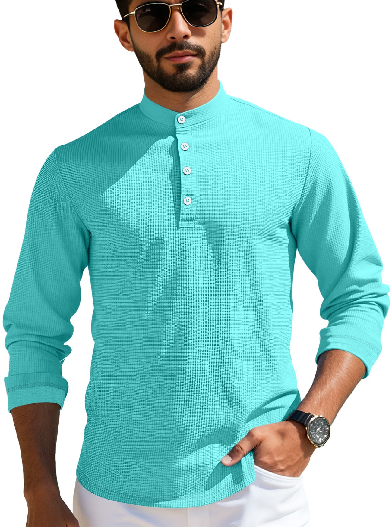 Man wearing turquoise textured Henley shirt with button placket and sunglasses
