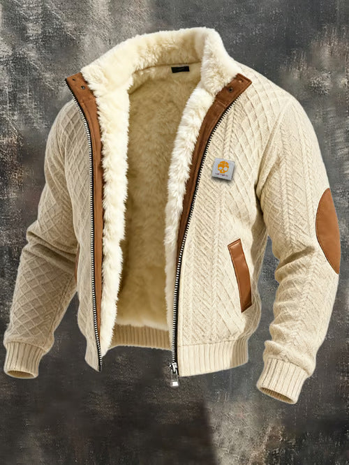 Beige quilted men's jacket with brown leather elbow patches and inner fleece lining on gray background