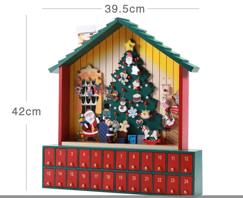 Wooden Christmas advent calendar shaped like a house with festive tree, Santa, decorations, and 24 numbered drawers