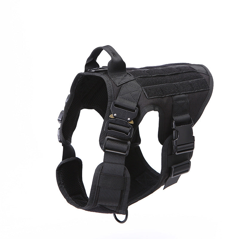 Black nylon tactical dog harness with quick-release buckles and handle on white background