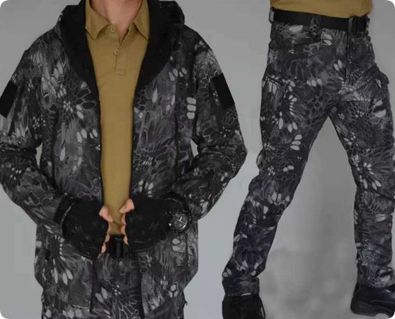 Men's black camouflage training suit with hooded jacket and pants, worn with brown shirt and black boots