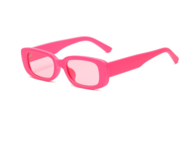 Pink rectangular fashion sunglasses with tinted lenses and thick frames on white background