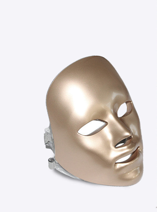 gold metallic LED facial beauty mask for skin rejuvenation with eye, nose, and mouth openings