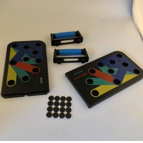Portable folding push-up board with color-coded holes and detachable blue handles on a white floor