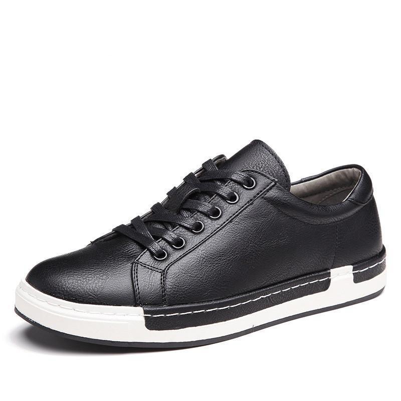 Black men's leather sneaker with black laces and white rubber sole on white background