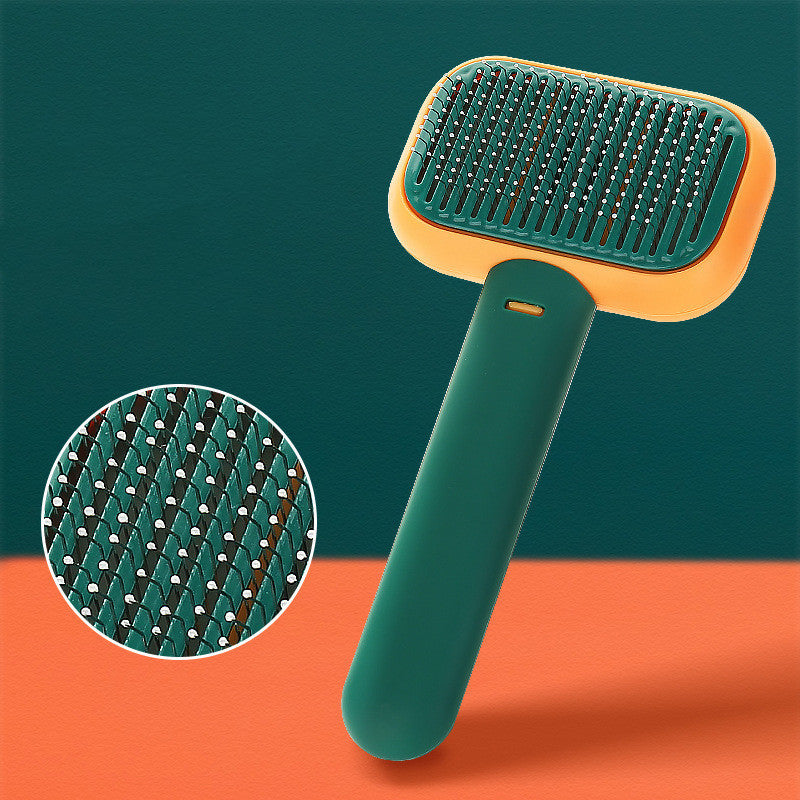 Ergonomic pet grooming brush with green and orange handle and fine metal bristles for shedding