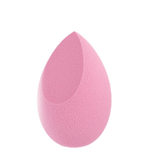 Pink makeup sponge beauty blender with teardrop shape and flat edge on white background