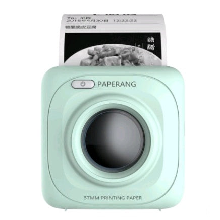 Compact mint green Paperang 57mm portable thermal printer printing photo receipt