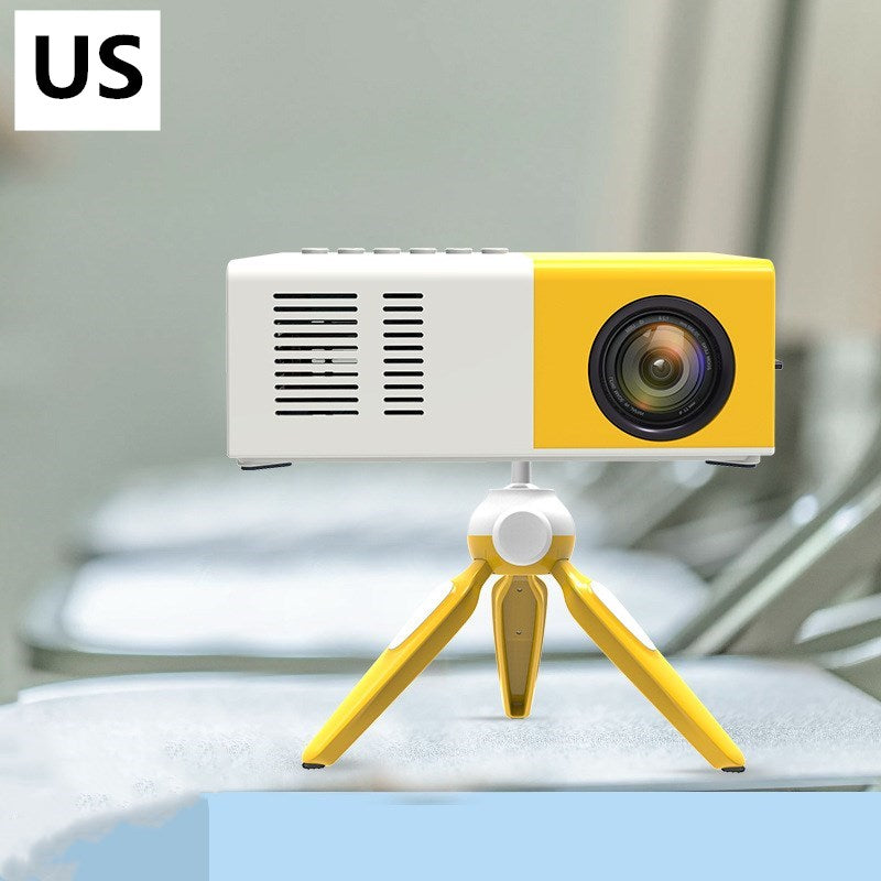 Yellow and white mini LED projector on a matching yellow tripod, portable home cinema device