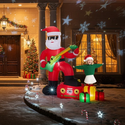 5ft inflatable Santa Claus with green guitar and boombox in snowy yard with Christmas lights and decorated tree