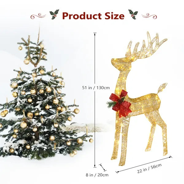 51-inch tall outdoor lighted Christmas reindeer decoration with red bow next to decorated snow-covered Christmas tree