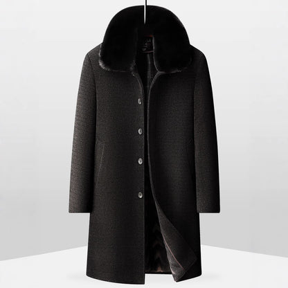 Black wool overcoat with fur collar and button closure on plain background