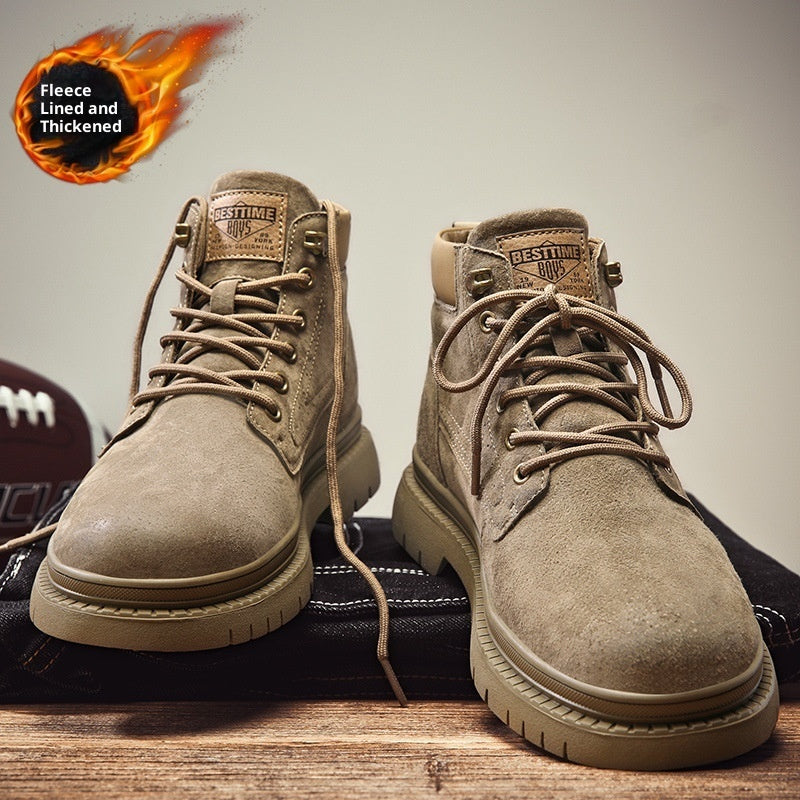 Beige suede fleece-lined boys' ankle boots with thick soles and laces on wooden surface