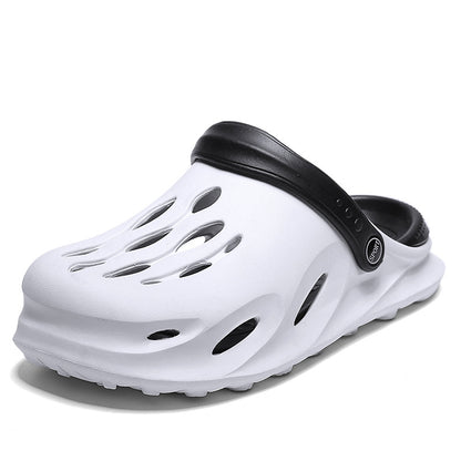 White and black sport clog sandal with ventilation holes and adjustable heel strap