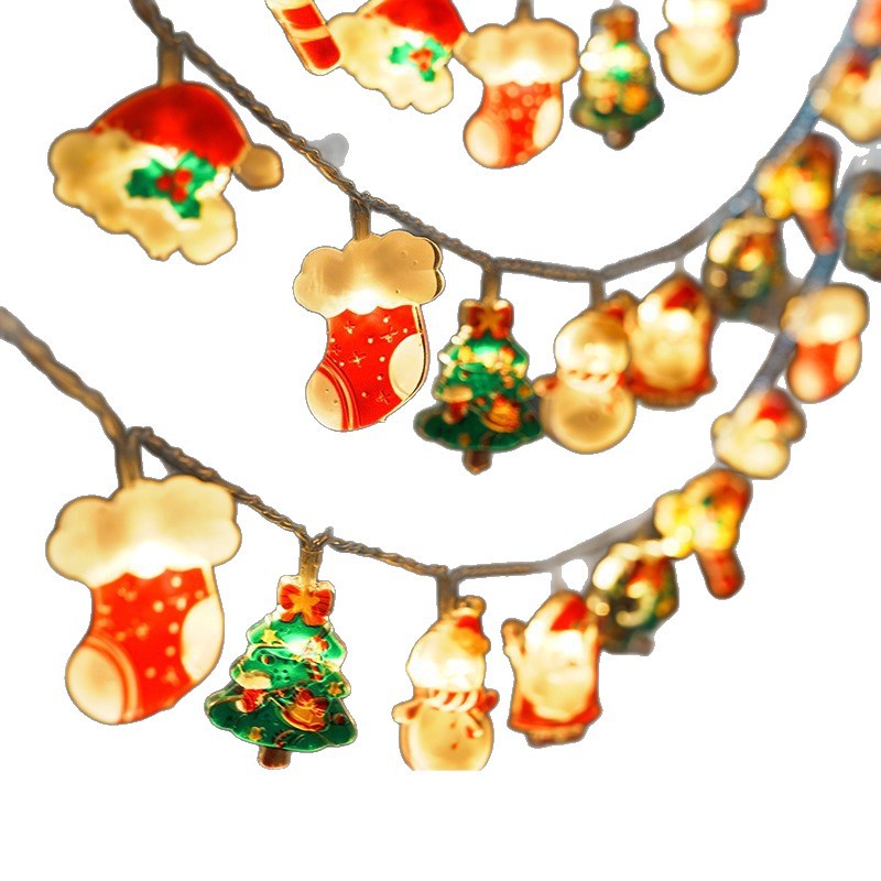 Festive Christmas string lights featuring glowing stockings, Christmas trees, snowmen, and Santa hats