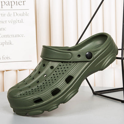 olive green ventilated clog shoe displayed on white surface with black metal frame background