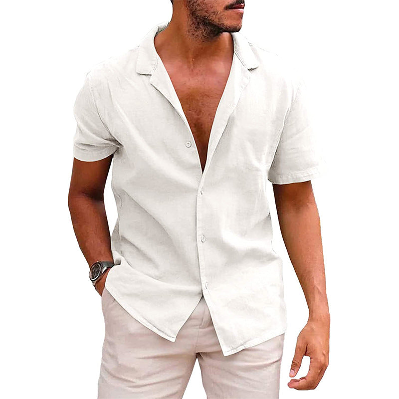 Man wearing white short-sleeve linen shirt with open collar and light beige pants