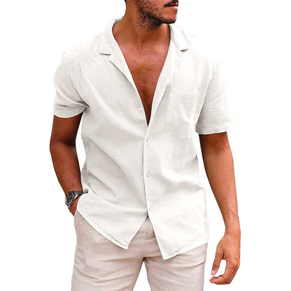 Man wearing white short-sleeve linen shirt with open collar and light beige pants