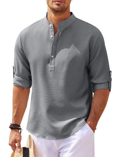 Man wearing casual gray textured long-sleeve shirt with mandarin collar and white shorts