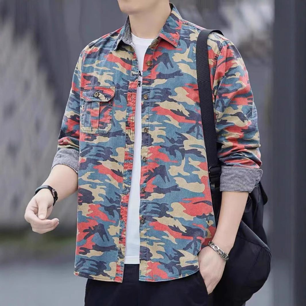 Man wearing multicolor camouflage shirt with rolled sleeves and black shoulder bag
