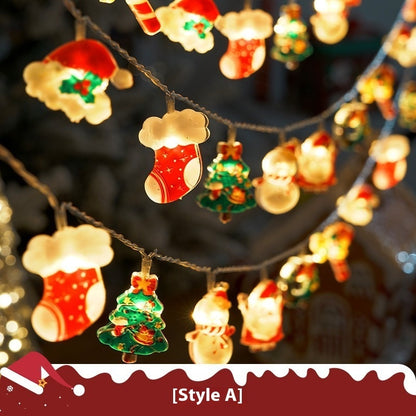 Glowing Christmas string lights featuring stockings, Christmas trees, snowmen, and Santa Claus ornaments