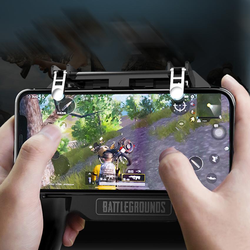 Hands holding a smartphone with PUBG mobile gameplay using a Battlegrounds gaming controller with triggers