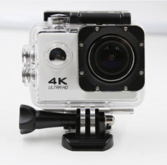 4K Ultra HD action camera in clear waterproof housing with black mount on white background