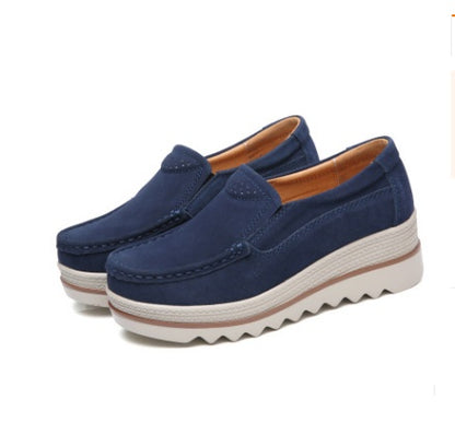 Navy blue suede casual slip-on shoes with white textured platform soles