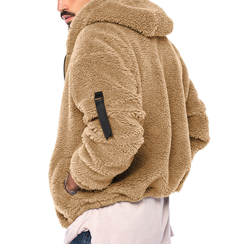 Man wearing cozy tan sherpa fleece jacket with black zipper detail on sleeve, styled casual
