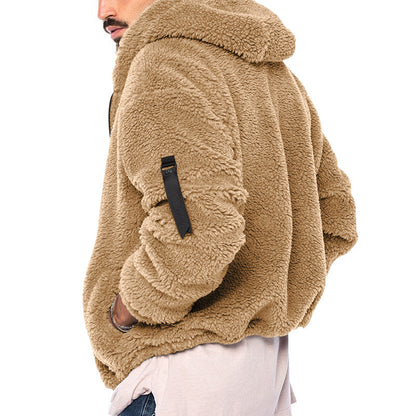 Man wearing cozy tan sherpa fleece jacket with black zipper detail on sleeve, styled casual