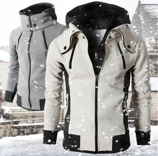 two winter hooded jackets with zippers, one grey and one beige with black accents, snowy background