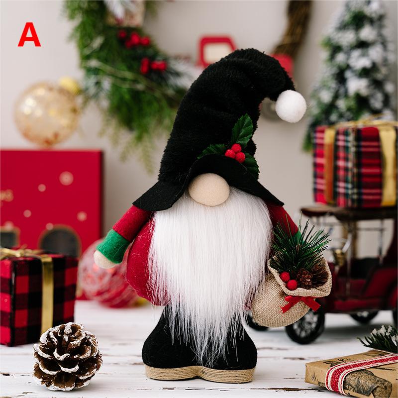 Christmas gnome figurine with white beard, black hat, and red outfit holding pinecone decoration
