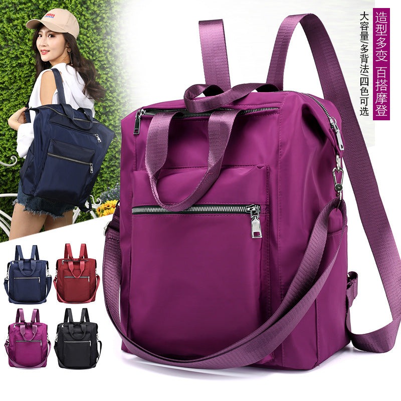 Purple large capacity multifunctional backpack handbag with zippered pockets and adjustable straps