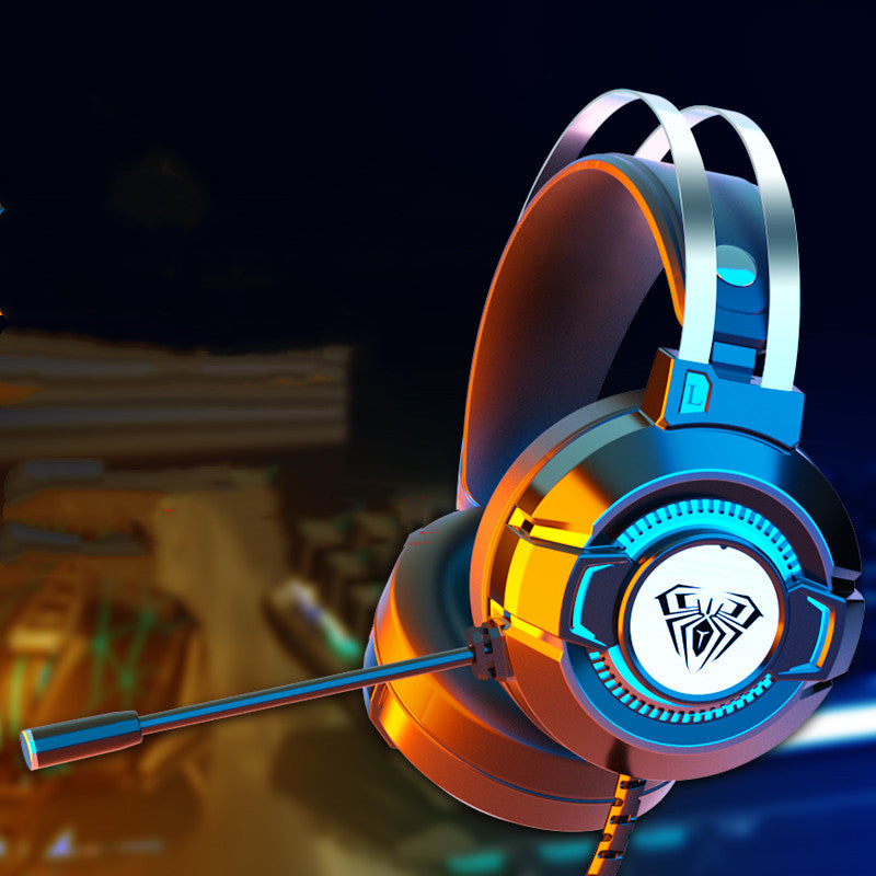 Modern gaming headset with microphone and spider logo, illuminated in orange and blue lighting