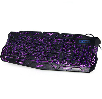 Black gaming keyboard with purple lightning backlight and multimedia keys on a white background