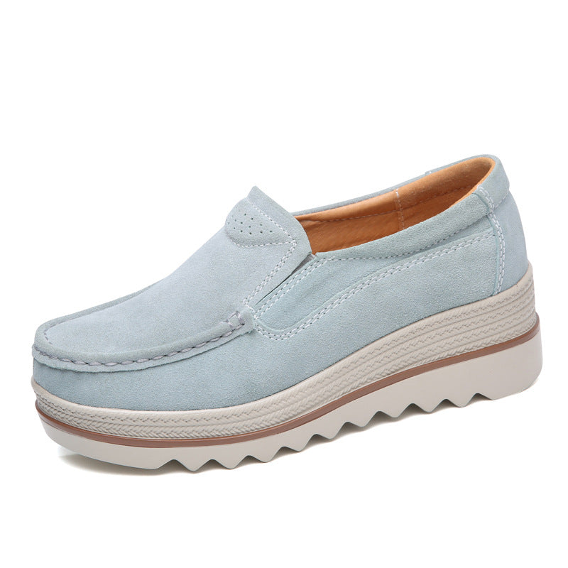 Light blue suede slip-on casual women's shoe with thick textured sole and brown interior lining