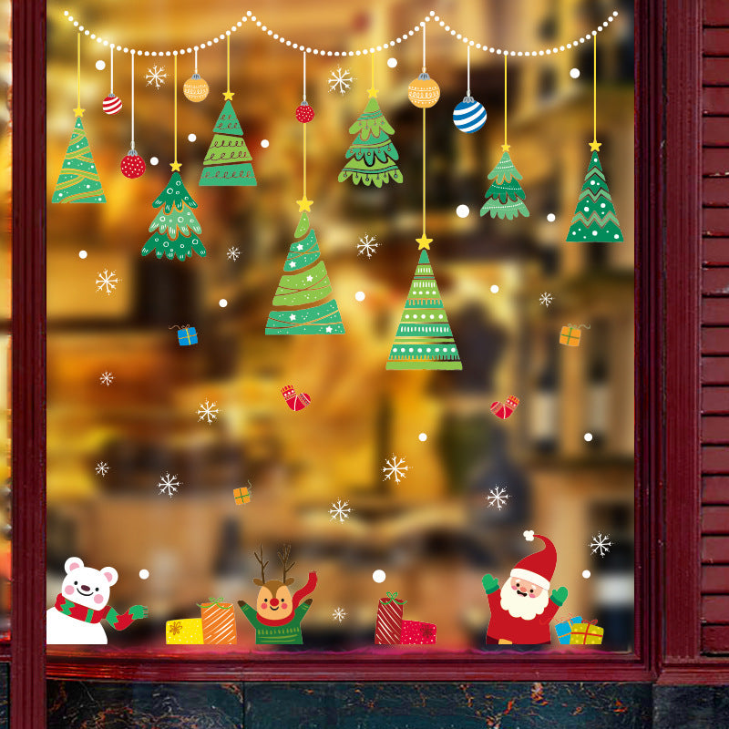 Christmas window decoration with hanging trees, ornaments, snowflakes, gift boxes, Santa, reindeer, and polar bear