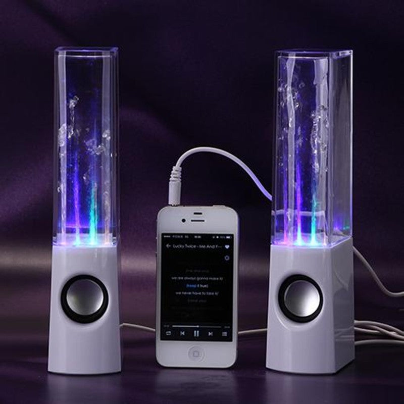 White water dancing speakers with colorful LED lights connected to a smartphone with audio cable