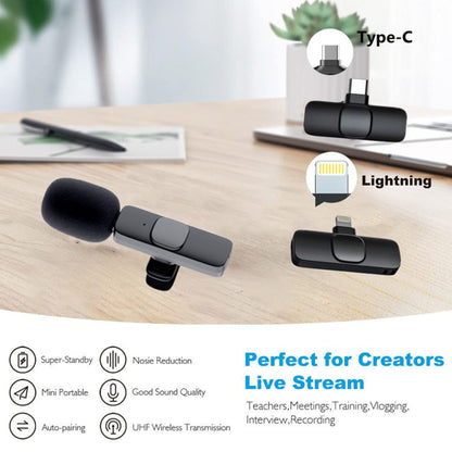 Wireless clip-on microphone with Type-C and Lightning connectors on wooden desk, ideal for live streaming and recording