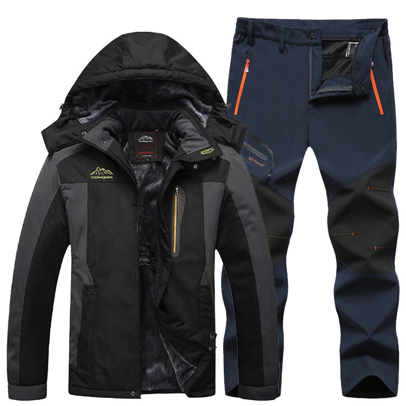 black and gray insulated waterproof hiking jacket with hood and navy blue outdoor pants with reinforced knees