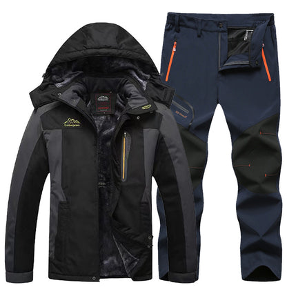 black and gray insulated waterproof hiking jacket with hood and navy blue outdoor pants with reinforced knees