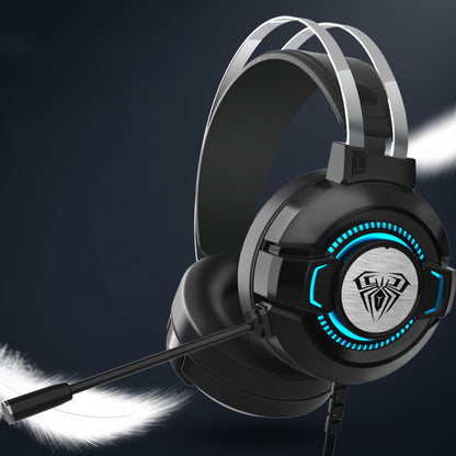 Black over-ear gaming headset with microphone, blue LED lights, and spider logo on earcup